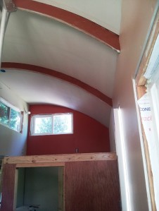 Saffron Spice accent wall in the Sitting loft with copper exposed beams